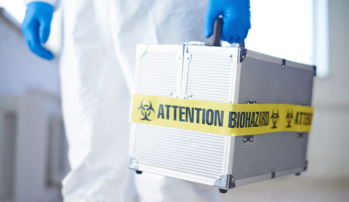 Biohazard professional with tool box