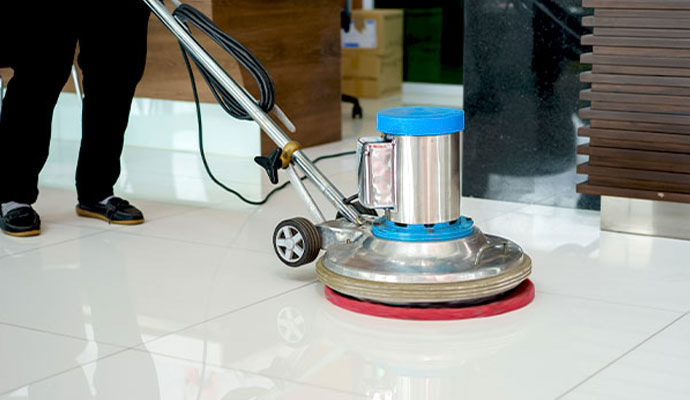 Professional cleaning floor using a scrubber