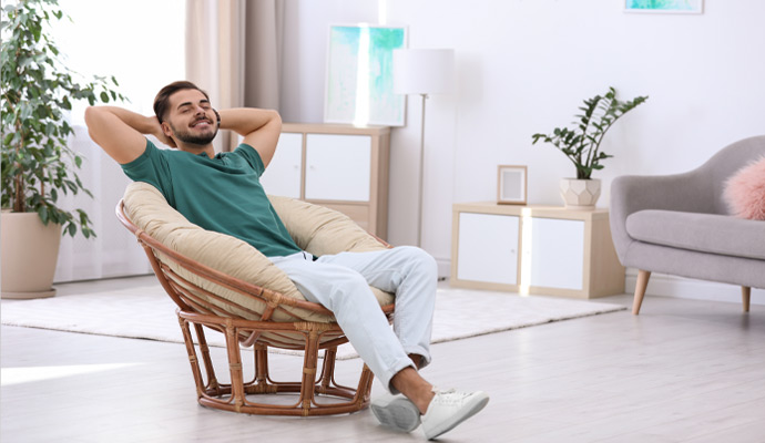 Homeowner relaxing comfortably in a clean living room with improved indoor air quality