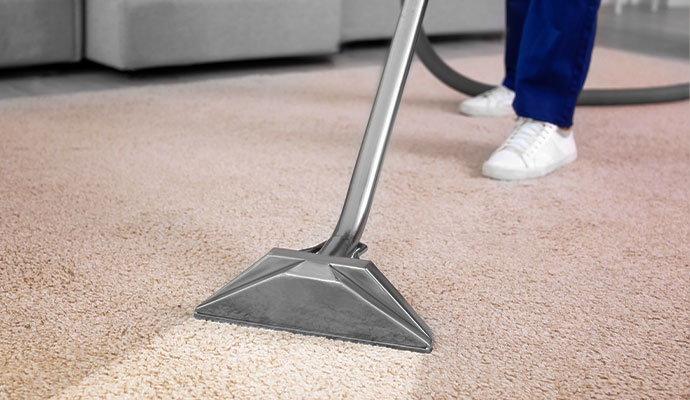 Professional carpet cleaning steam wand cleaning beige residential carpet
