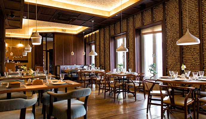 Restaurant interior with wooden furniture.