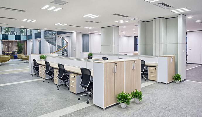 Modern restored commercial office space with modular workstations and clean interior