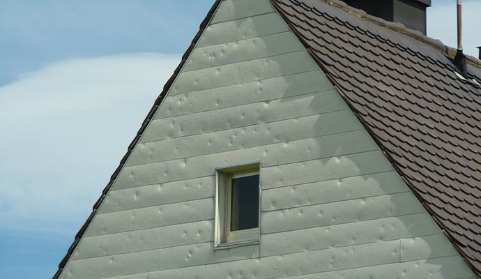 Hail damage on house siding