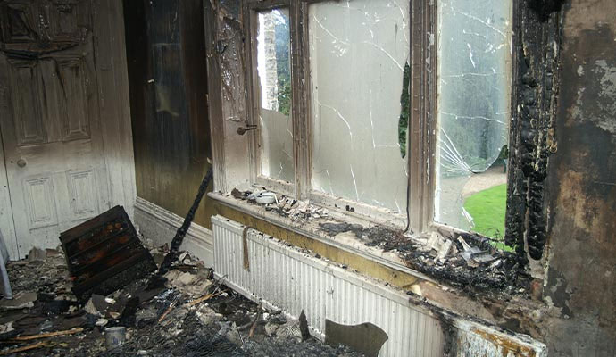 Smoke and soot damaged room interior