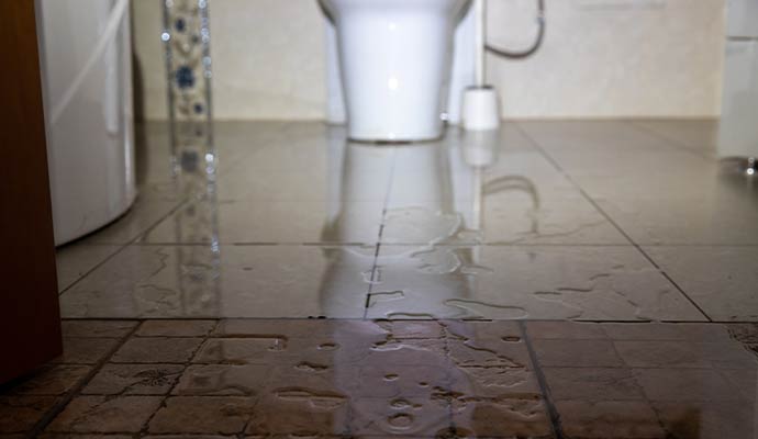 Bathroom floor water damage flooding