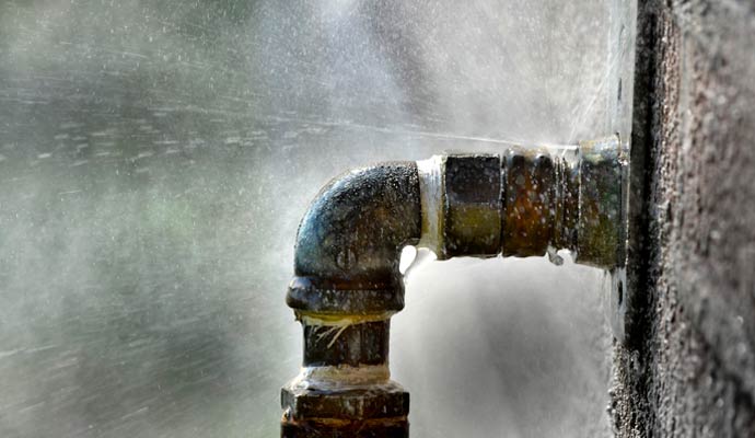 Leaking pipe elbow joint plumbing